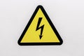 Yellow sigh danger electric shock with lightning in triangle on a metal door. Danger Electrical Hazard High Voltage Sign Royalty Free Stock Photo