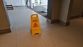 Yellow sign that alerts for wet floor