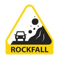 Yellow sign caution rockfall. stone falls on a car.