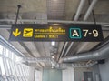 Yellow sign with a gate number at Suvarnabhumi International Airport