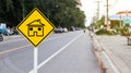 Yellow sign with graphic of house to warn traffics to beware of neighborhood Royalty Free Stock Photo