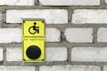 Yellow sign with help button calling for disabled people, Braille blind duplication