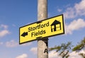 Yellow sign indicating directions to a new housing development. UK