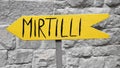 Yellow sign with italian writing `mirtilli` meaning in english `bluberries` Royalty Free Stock Photo