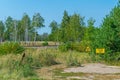 Yellow sign marking buried radioactive material in Chernobyl exclusion zone in the Ukraine Royalty Free Stock Photo