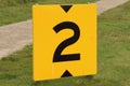 Yellow sign at rowing facility in Zeven huizen with the number 2 Royalty Free Stock Photo