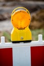 Yellow signal lamp on construction site Royalty Free Stock Photo