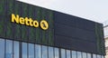 Yellow signboard of a popular food store in Denmark - Netto. Royalty Free Stock Photo