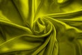 Yellow silk delicate fabric twisted and folded in drapery