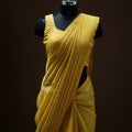 Yellow Silk Saree Draped On Mannequin. AI-Generated Royalty Free Stock Photo
