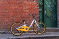 Yellow and silver bike on the street