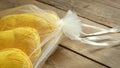 Yellow Skeins of Yarn in a Soft, White Drawstring Bag