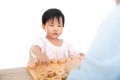 The yellow-skinned little girl is playing Chinese chess with an adult seriously Royalty Free Stock Photo