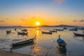 yellow sky during sunrise above fishing boats in Rawai sea Royalty Free Stock Photo