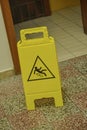 Yellow slippery floor sign, indoors Royalty Free Stock Photo