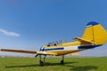 Yellow small plane on grass Royalty Free Stock Photo