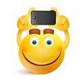 Yellow smiley face character with smart phone