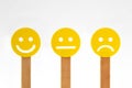 Yellow smiley faces with positive, neutral and negative expression
