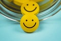 yellow smiley pills spilling out of a toppled pill bottle Royalty Free Stock Photo