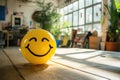 A Yellow Smiling Ball Can Promote a Positive Work Environment. Royalty Free Stock Photo