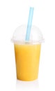 Yellow smoothie in plastic transparent cup Royalty Free Stock Photo