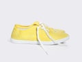 Yellow sneakers isolated on white background