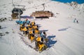 Yellow snow cannons on slope