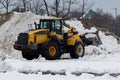 yellow snow plow tractor