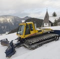 Yellow snowcat snow dub Royalty Free Stock Photo