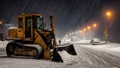 yellow snowplow removing snow from winter roads in winter time after night storm in a city Royalty Free Stock Photo