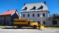 Yellow snowplow on the streets of Zabljak in Montenegro. Preparing for winter in the highlands