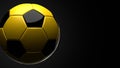 Yellow soccer ball on black text space.