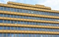 Yellow socialist building with a lot of windows in Budapest