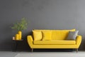 Yellow sofa and decorative home decor accent pieces against grey and yellow wall with copy space