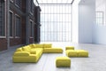 Yellow sofas in an office waiting area, black Royalty Free Stock Photo