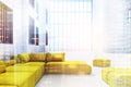 Yellow sofas in an office waiting area, double Royalty Free Stock Photo