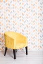 Yellow soft armchair in a room