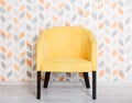 Yellow soft armchair in a room