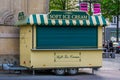 Yellow soft ice cream cart with closed shutter, Mobile ice cream shop in the center of antwerp, Antwerpen, Belgium, April 23, 2019