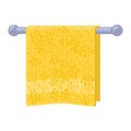 Yellow soft terry towel hanging on metal holder attached to wall. Light red bathroom interior element.