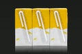 Yellow soy milk boxes isolated on a black