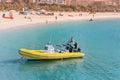 Yellow speedboat waits tourists for tours and excursions around the Persian Gulf in Dubai. Transportation and active