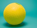 Yellow Sphere With Grid Pattern On Teal Background Royalty Free Stock Photo