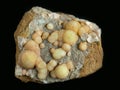 Yellow spheres of pearly wavellite mineral