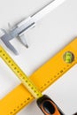 Yellow spirit level and caliper Royalty Free Stock Photo