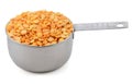 Yellow split peas in a cup measure Royalty Free Stock Photo