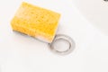 Sponge with foam inside sink Royalty Free Stock Photo