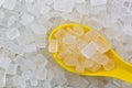 Yellow spoon full of White Rock Sugar Rock candy, Crystallized Royalty Free Stock Photo