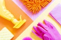 Yellow spray, pink gloves, orange rag. Housekeeping and cleaning the house concept