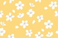 Yellow spring background with white tree blossom. Apple and peach flowers, falling petals. Asian sunny seamless texture